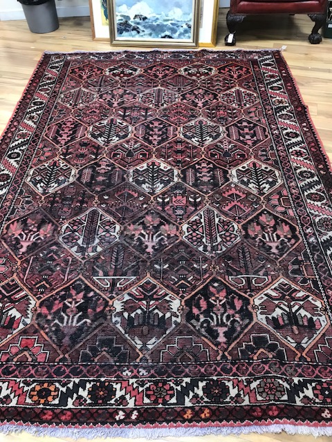 A Baktiari brick red ground carpet 291 x 210cm